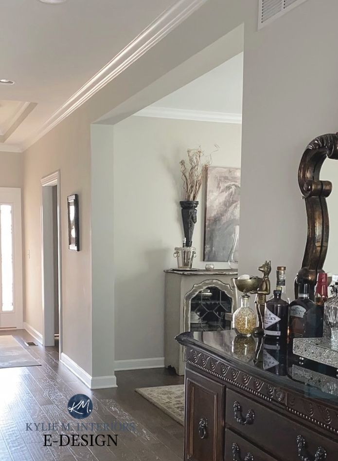 the hallway is clean and ready for guests to use it as an entrance way in this home