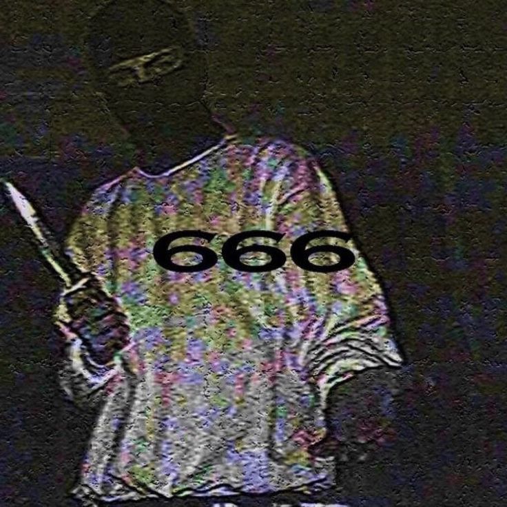 a man holding a knife in his hand with the number 666 written on it