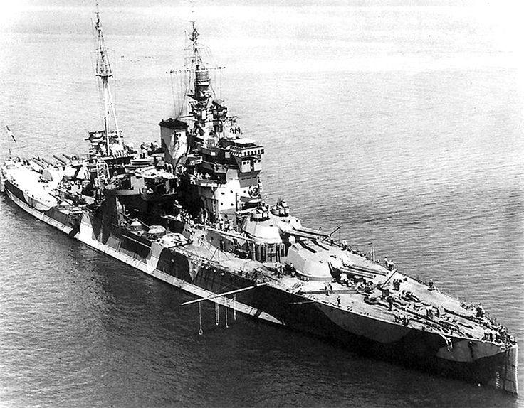 an old photo of a battleship in the water