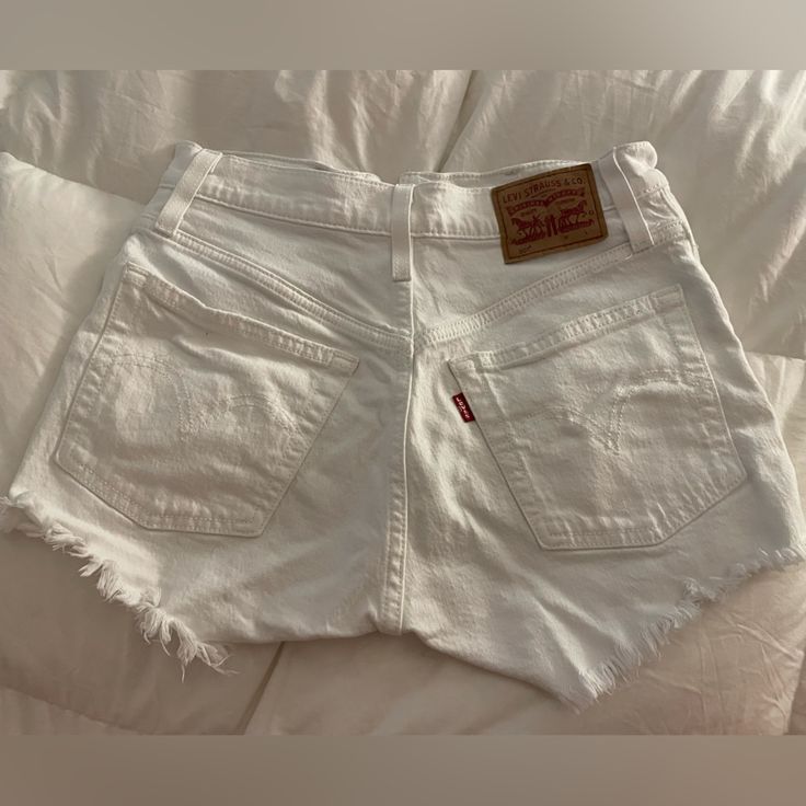 Nwot. Size 25, Bought Online And They Were Too Small. These Have Multiple Buttons Instead Of A Zipper Which I Loved. White Fitted Jean Shorts For Day Out, Fitted White Jean Shorts For Day Out, White Cutoff Jean Shorts For Day Out, Levi's Mid-rise Cotton Shorts, Levi's Cotton Jean Shorts For Summer, White Fitted Jean Shorts With Pockets, Mid-rise White Jean Shorts For Day Out, White Fitted Mid-rise Shorts, Levi's Summer Shorts