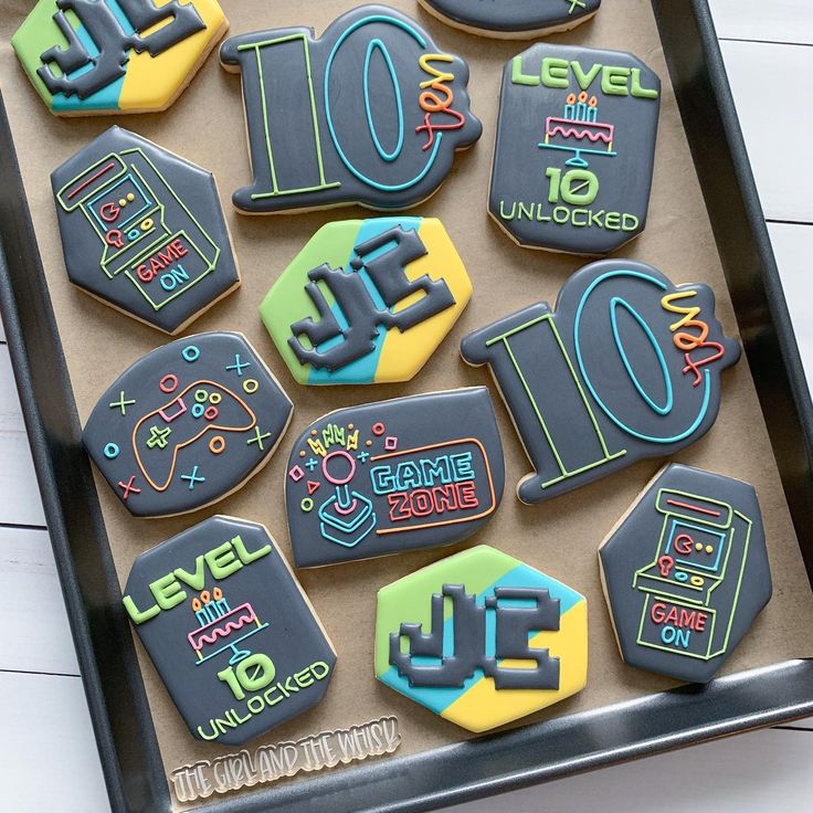 decorated cookies in the shape of numbers on a tray