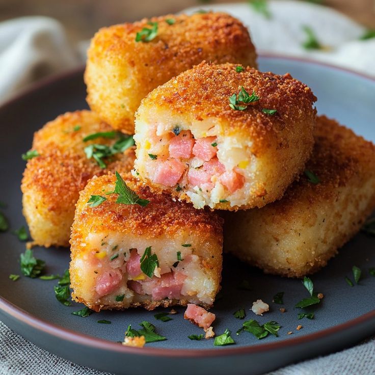 some food on a plate with parsley sprinkled around the edges and cut in half