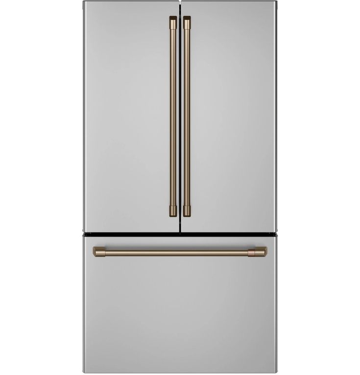 a stainless steel refrigerator freezer with two doors and gold trimmings on the bottom