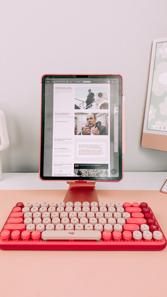 a red computer keyboard sitting on top of a desk