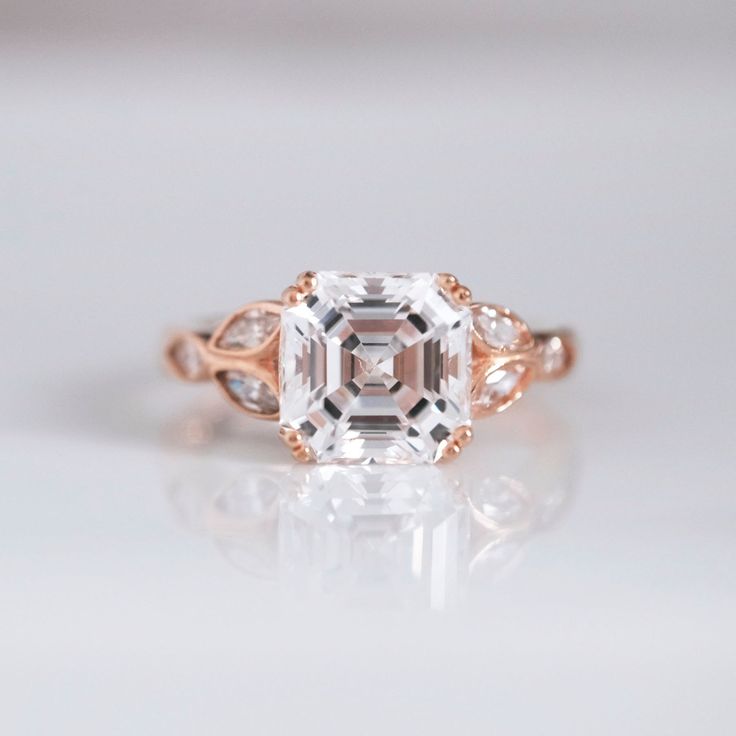 The Boss Asscher Rings is for those who know they're boss. Period. Center Stone: Asscher Cut Center Stone Carat Weight & Dimension: 4.12 ct, 9mm Overall Dimension: 9mm(L) x 9mm(W) Carat Weight: 4.72 ctw Asscher Ring, Asscher Engagement Ring, Asscher Cut, Ring Sizer, The Boss, Silver Roses, Silver Rose Gold, Cluster Ring, 18k Rose Gold