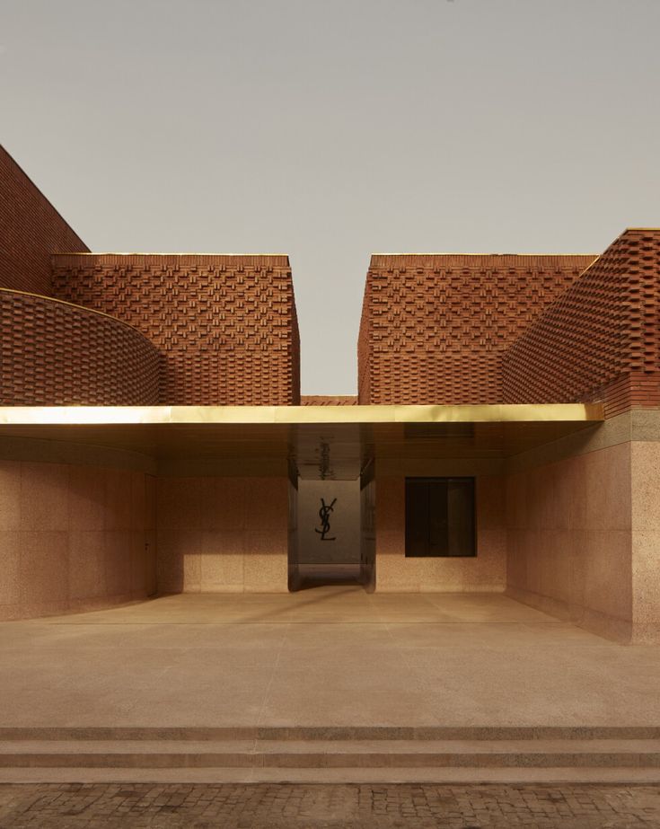 an empty parking lot with steps leading up to the building's roof and entrance