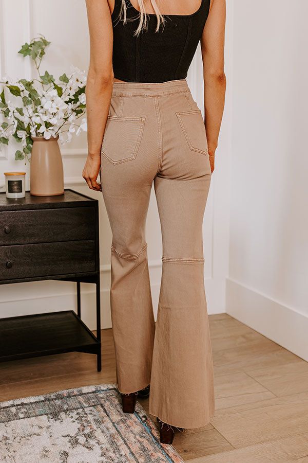 - The cutest flares of the season are a must-have for your trendy wardrobe! - Unlined stretchy denim material - A waistline with a hidden zip fly and button closure - Functional side and back pockets - A flattering silhouette that ends in raw cut floor length flared hemlines Measurements S : Front Rise 12", Hip 34", Inseam 30.5", Length 41.5", Waist 27". M : Front Rise 12.5", Hip 35", Inseam 31", Length 42", Waist 28". L : Front Rise 13", Hip 36", Inseam 32", Length 43", Waist 29".