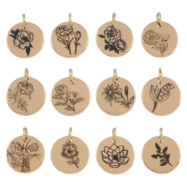 twelve flower charms in various shapes and sizes on a gold plated charm with black ink