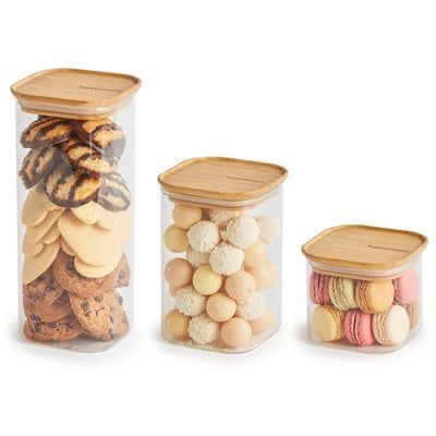 three containers filled with different types of cookies