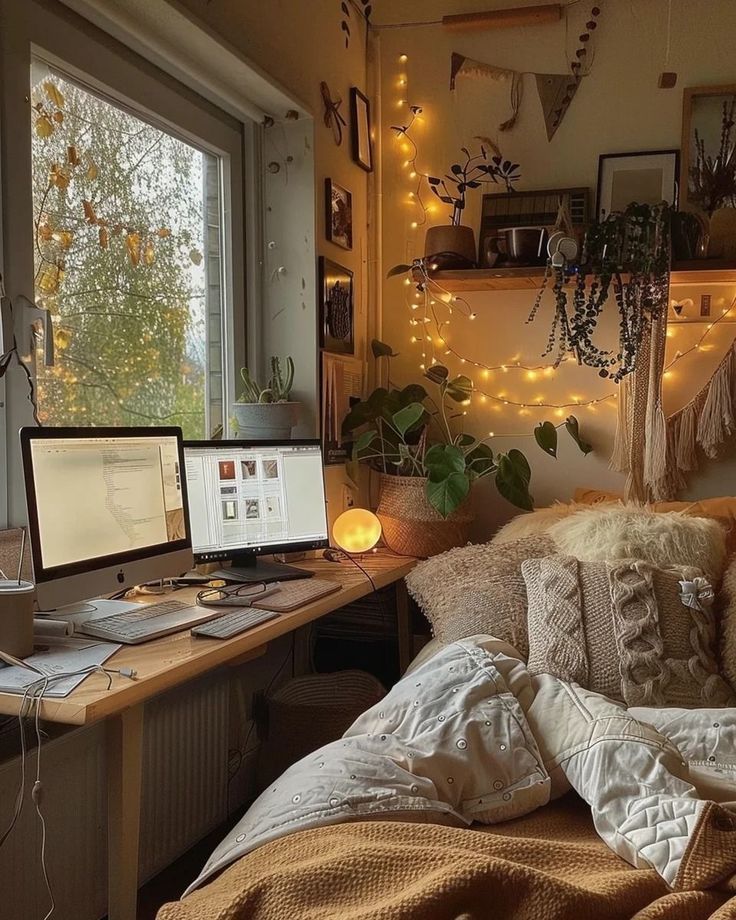 a bedroom with a bed, desk and laptop computer on it in front of a window