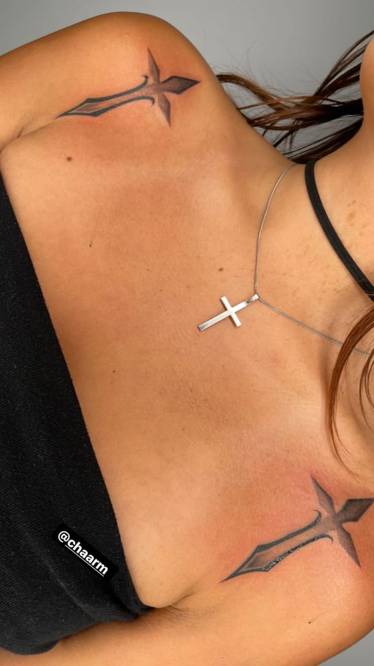 a woman with a cross tattoo on her chest