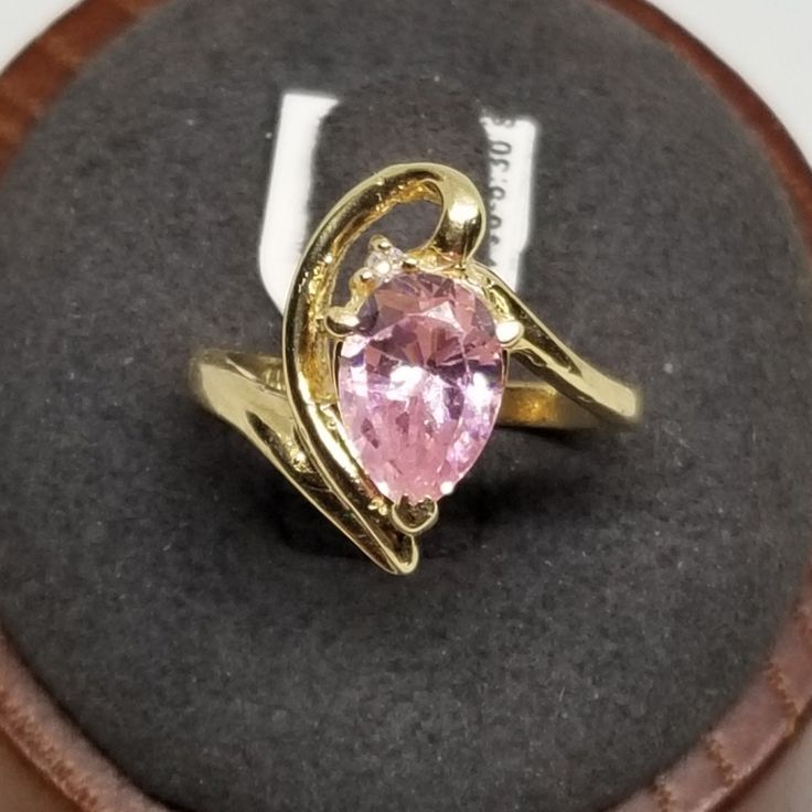 Z2119 Vintage 14K Yellow Gold Ring with a Pink Ice Diamond, Size 5.75, Damaged. Surface has chips and scratches. Marked 14K inside band. Stone is 8 x 6mm. Ring is 16mm wide. Weighs 2.6 dwt. We do not check prongs for wear or stones for looseness. All items are sold as is-noting that we are a resale shop so everything here had a previous owner! We will include flaws in the description when noted. This is one of the reasons our items are more affordable than new at a jewelry store. Are these stones real or fake? Aside from diamonds, we do not know if any gemstones are natural or synthetic. We will state on certain gemstones, that we know 100%, if they are created or fake due to their lack of inclusions. For this reason, we do not sell any diamonds without inclusions, and the larger diamonds Gold Teardrop Topaz Ring For Formal Occasions, Yellow Gold Teardrop Rings With Accent Stones, 14k Gold Pear-shaped Rings With Accent Stones, Gold Teardrop Jewelry With Center Stone, Pear-shaped 14k Gold Rings With Accent Stones, Formal Gold Pear-shaped Topaz Ring, Teardrop Hallmarked Ring For Anniversary, Formal Heart Cut Rings Stamped 14k, Hallmarked Teardrop Anniversary Ring