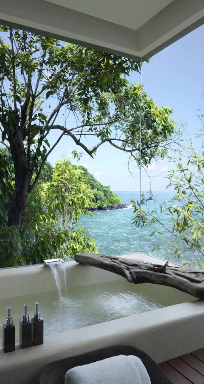 an outdoor jacuzzi tub overlooking the ocean