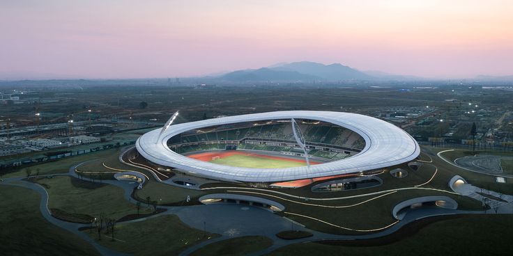 an aerial view of a soccer stadium at dusk