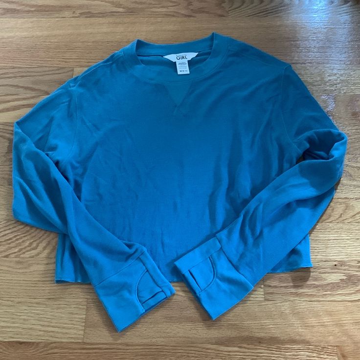 Never Worn. Excellent Condition. Like New M/ 8-10 Smoke Free/Pet Free Home Solid Sportswear Tops With Ribbed Cuffs, Relaxed Fit Sports Tops With Ribbed Cuffs, Light Blue Lounge Top With Ribbed Cuffs, Light Blue Casual Sweatshirt For Sports, Casual Tops With Ribbed Cuffs For Gym, Blue Cotton Sportswear Activewear, Blue Sporty Gym Sweatshirt, Blue Sporty Sweatshirt For Gym, Light Blue Relaxed Fit Sporty Top