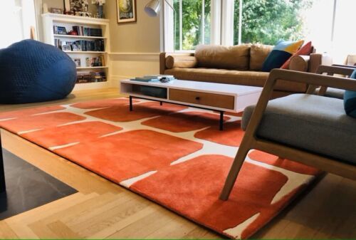 a living room filled with furniture and a large window