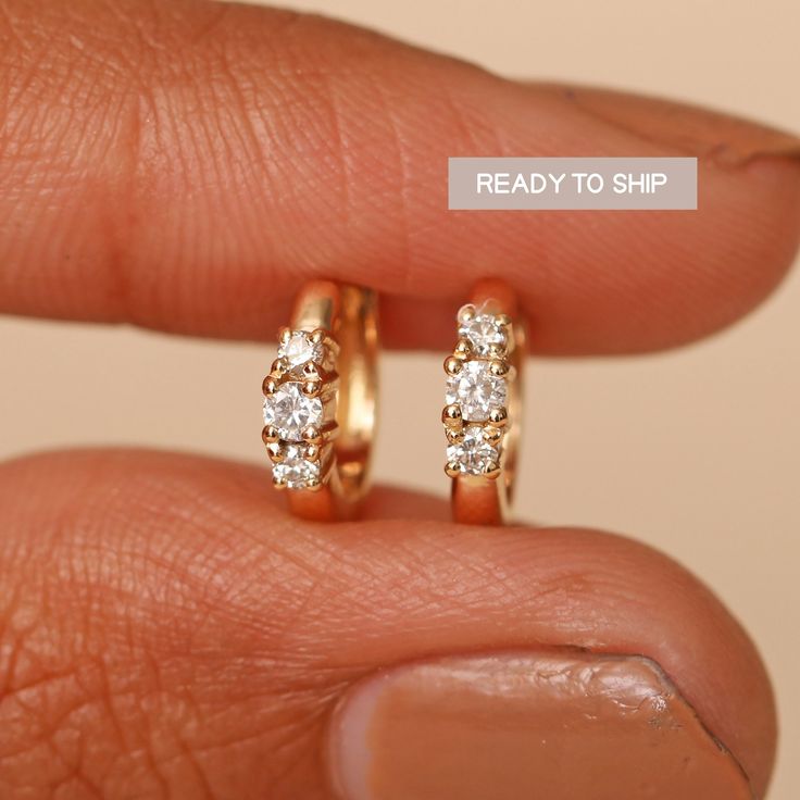 Made In Solid 14k Yellow Gold 3 Diamond Dainty Hoops/ genuine Diamond Baby Earrings/Handmade Jewelry Fine/ Delicate Earring/ Natural Diamond Earring. "𝐘𝐄𝐋𝐋𝐎𝐖 𝐆𝐎𝐋𝐃 𝐈𝐒 𝐑𝐄𝐀𝐃𝐘 𝐓𝐎 𝐒𝐇𝐈𝐏 𝐀𝐍𝐃 𝐑𝐎𝐒𝐄 𝐆𝐎𝐋𝐃 & 𝐖𝐇𝐈𝐓𝐄 𝐆𝐎𝐋𝐃 𝐖𝐈𝐋𝐋 𝐁𝐄 𝐌𝐀𝐃𝐄 𝐓𝐎 𝐎𝐑𝐃𝐄𝐑" Great Gift For Mom, Sister, Friend, Girlfriend and Daughter. For Trio Ruby Hoops : https://www.etsy.com/listing/1185166585 Also available in Rose Gold, White Gold and Yellow Gold. 𝐏𝐫𝐨𝐝𝐮𝐜𝐭 𝐢𝐧𝐟𝐨: 𝟏𝟒? Delicate Diamond Wedding Jewelry, Elegant Tiny 14k Gold Huggie Earrings, Tiny Round Huggie Earrings For Anniversary, Wedding Diamond Jewelry, Delicate Single Diamond Earring For Wedding, Elegant Tiny 14k Gold-filled Huggie Earrings, Gold Huggie Cartilage Earrings For Wedding, Minimalist Diamond Cartilage Earrings For Wedding, Elegant Tiny Hoop Earrings For Anniversary