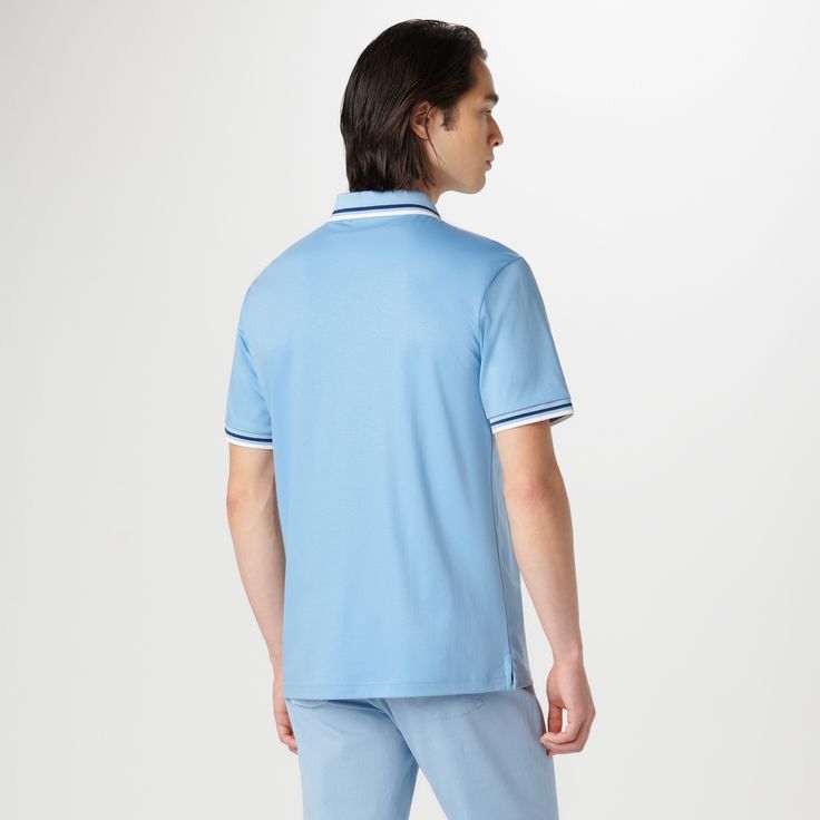 This classic yet stylish short-sleeved polo shirt in 100% Pima cotton features a chest pocket, a quarter zipper closure, a polo collar and double contrast tipping detail, adding a touch of flair to casual. Blue Collared Polo Shirt With Placket, Blue Polo Shirt With Striped Collar, Blue Polo Shirt With Collar And Placket, Blue Polo Shirt With Collar, Blue Polo Shirt With Collar Placket, Blue Sporty Polo Shirt With Ribbed Collar, Sporty Polo Shirt With Contrast Collar And Short Sleeves, Casual Polo Shirt With Contrast Trim, Sporty Blue Collared Polo Shirt