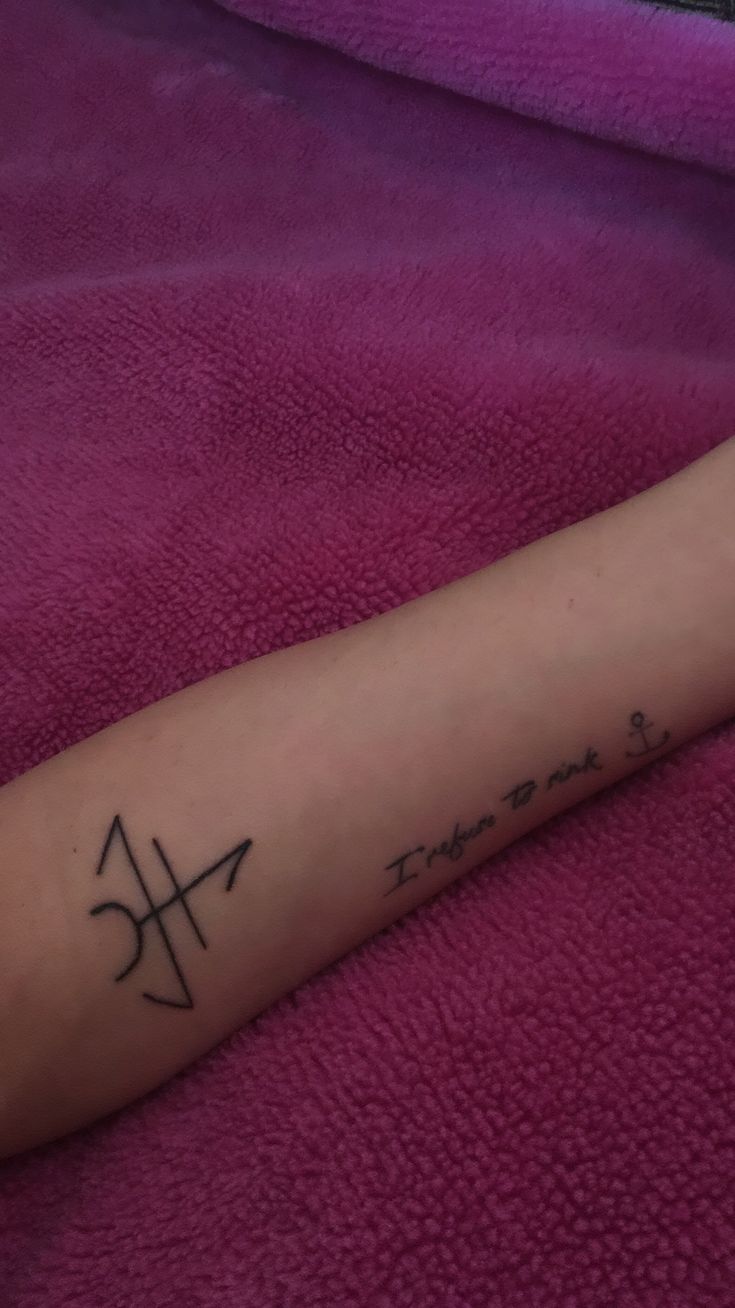 a person with a tattoo on their arm that reads, time to fly and an arrow