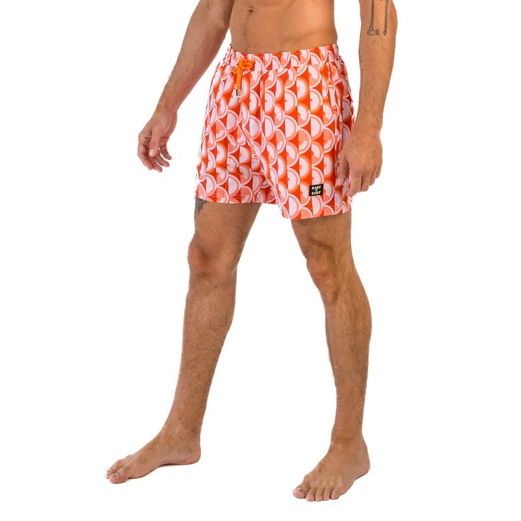 Step back in time to the 70s with East x East Island Fever men's shorts. Featuring a bold orange colorway and a retro-inspired design, these shorts are the perfect addition to any fashion-forward individual's summer wardrobe. Made with premium sustainable materials, these shorts not only look great but are eco-friendly too. The elasticated waist and drawstring adjustment ensure a comfortable and secure fit, making them perfect for any summer activity, from beach days to pool parties. With their Summer Activity, Orange Design, Pool Parties, Step Back, 70s Inspired, The 70s, Beach Days, Retro Vibe, Sustainable Materials