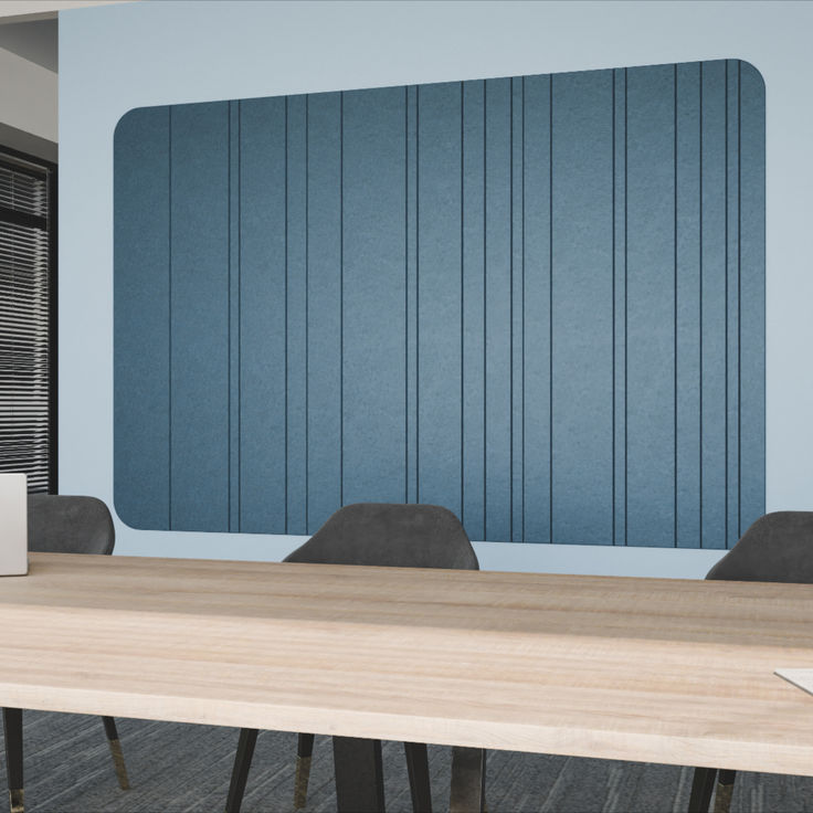 an empty conference room with a laptop on the table in front of a blue paneled wall