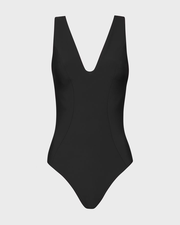 The Vida One Piece in Black is a flattering plunge V neck swimsuit, crafted from our Sculpteur® fabric, which supports and shapes the bust. Vida features wide, comfortable shoulder straps and flattering side panels which help define the silhouette. Vida features regular bottom coverage is suitable for large busts up to cup size DD. Fabric sustainably made in Italy.Garment sustainably made in Australia. Elastane V-neck Swimwear For Poolside, Black Fitted Swimwear With Wide Straps, Solid Color Seamless V-neck Swimwear, Chic Solid Color V-neck Swimwear, Black V-neck Lined Swimwear, Black Lined V-neck Swimwear, Black Seamless V-neck Swimwear, Sleek V-neck Seamless Swimwear, Elegant V-neck Swimwear For Sunbathing