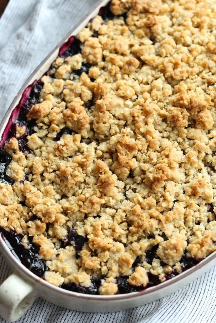 a close up of a pie in a pan on top of a table with a napkin