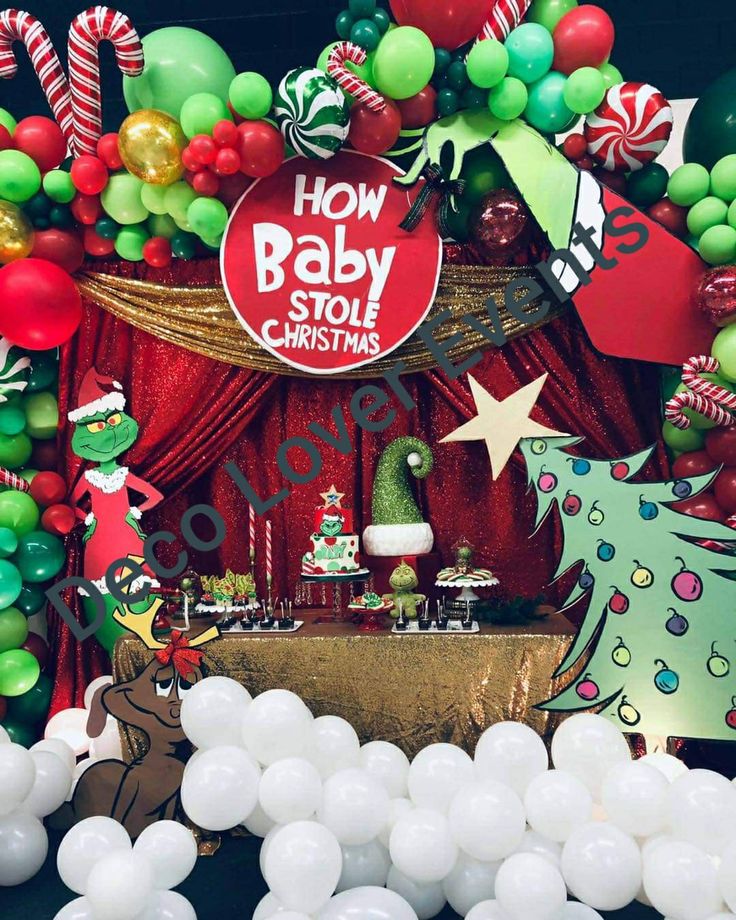 an image of a baby shower with balloons and christmas decorations on the table in front of it