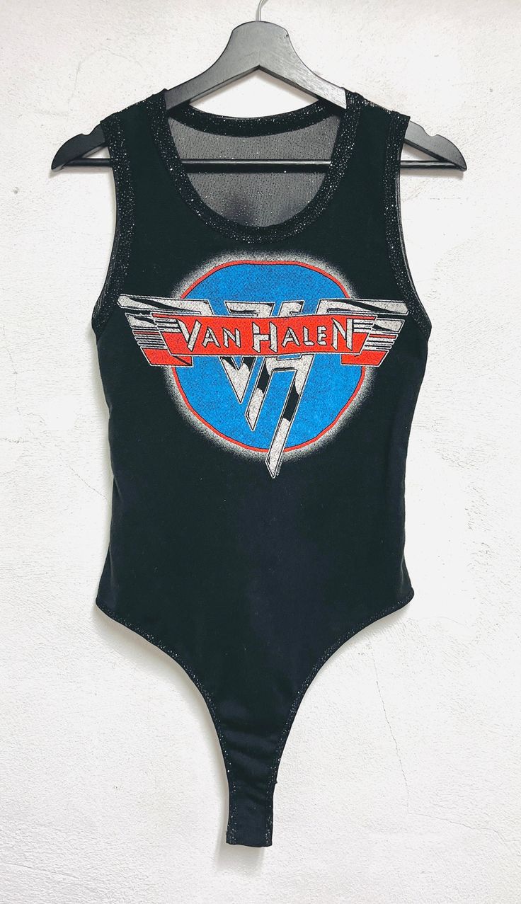 One of a kind handmade Van Halen bodysuit. Silver metallic detailing in the neckline and armholes.  Stretch metallic lightweight mesh fabric  on the back. Snaps on the bottom for easy entry.  Fitted  Size Small Bust 34-36 inch circumference Metallic Stretch Sleeveless Bodysuit, Metallic Sleeveless Stretch Bodysuit, Metallic Fitted Sleeveless Bodysuit, Metallic Sleeveless Fitted Bodysuit, Stretch Bodysuit For Summer Music Festival, Summer Music Festival Stretch Bodysuit, Metallic Stretch Bodysuit For Club, Fitted Black Bodysuit For Music Festival, Metallic Fitted Bodysuit For Summer