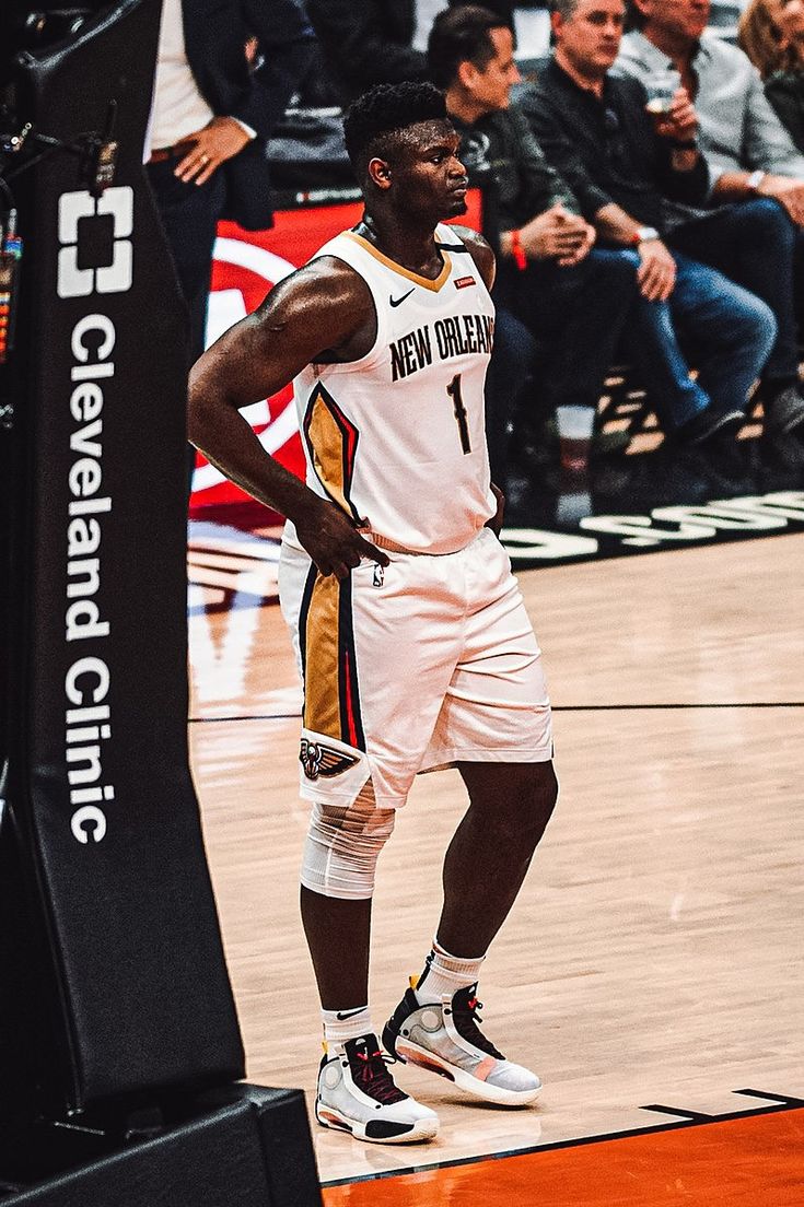 a basketball player is standing on the court