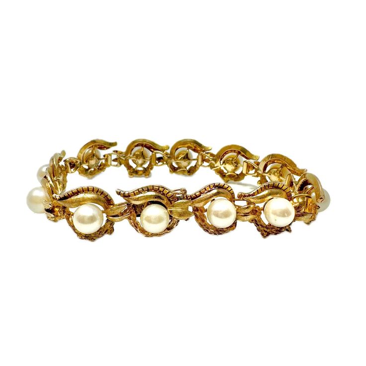 14K Gold Vintage 7.25" Bracelet with Pearls (includes appraisal, Value: $6,000) Designer = Jewelry Material = 14K Gold Gemstone = Pearl Condition = Good Location: Glencoe Item Number: 20229-16 Item ID: 281648 Category: Bracelet Formal Gold Pearl Bracelet With Oyster Design, Gold Oyster Pearl Bracelet For Formal Occasions, Gold Pearl Oyster Bracelet For Formal Occasions, Vintage Gold Pearl Bracelet For Formal Occasions, Luxury Pearl Bracelet With 17 Jewels, Classic Formal Pearl Bangle Bracelet, Vintage Gold Pearl Bangle Bracelet, Vintage Yellow Gold Pearl Bracelet For Formal Occasions, Gold Formal Costume Jewelry Bracelets