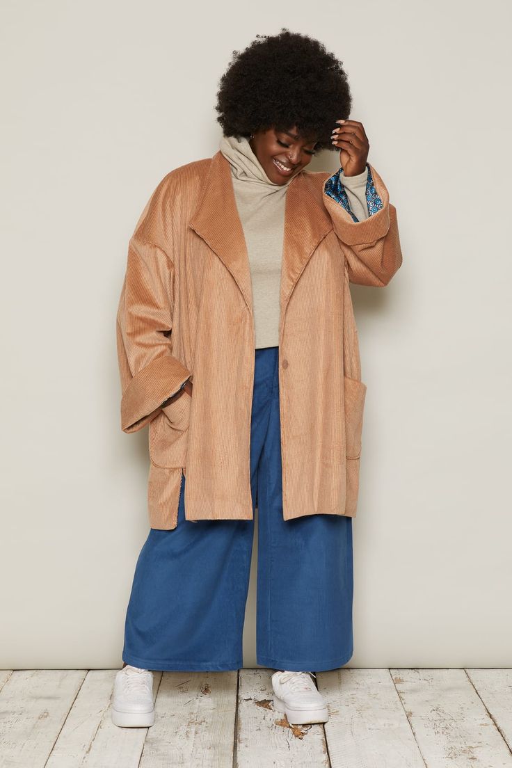 The Hilmar is a long, oversized jacket, falling to the mid-thigh. Oversized features make it iconic: large, patch pockets; side vents; a stepped hemline; and wide, turned-back cuffs. Beautifully lined, this jacket looks easy-going, and feels luxurious.Corduroy’s distinct quality comes from its ribs, or ‘wales’. Corduroy fabric can come in different thicknesses, depending on the width of its wale. Narrow-wale corduroy is fine and light. Wide-wale corduroy is chunky and fluffy-soft.In Beige, the corduroy is a wider wale. In Blue, the corduroy is narrower. The Burgundy sits in the middle of the two. Whichever you pick, these organic cotton corduroys look great, feel great and will stay soft and durable.Each jacket is numbered and production is limited to 100 pieces per colourway.Inclusive siz Oversized Solid Single Breasted Outerwear, Oversized Solid Outerwear With Pockets, Oversized Beige Outerwear For Work, Beige Relaxed Fit Outerwear With Lapel Collar, Oversized Lapel Collar Outerwear For Spring, Beige Relaxed Fit Single Breasted Outerwear, Beige Single Breasted Outerwear With Relaxed Fit, Beige Relaxed Fit Outerwear For Fall, Beige Single Breasted Relaxed Fit Outerwear