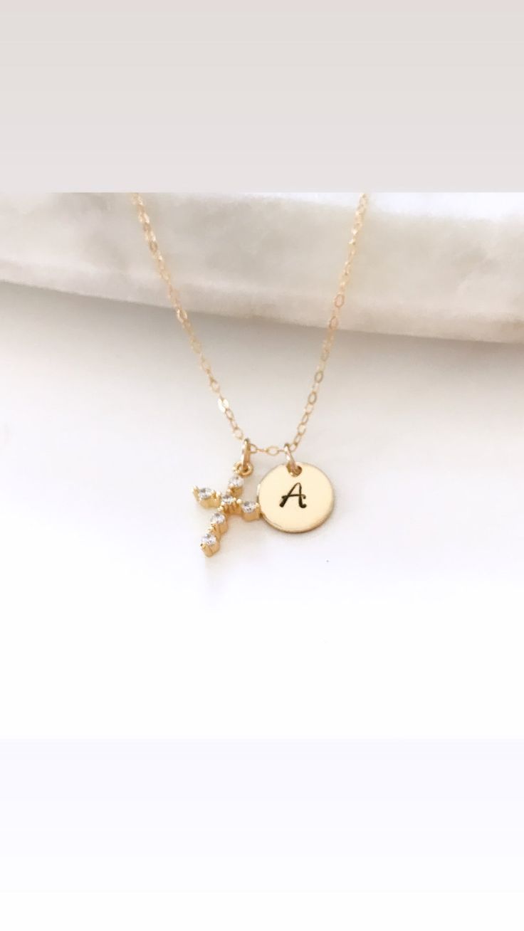 cross necklace, dainty necklace, gifts for her, personalized necklace, initial necklace, dainty gold necklace, minimalist, handmade jewelry, gifts♥Wear your special symbol of faith wherever you go. Featuring a fine CZ cross pendant and initial, this eye-catching piece is a classic that never goes out of style! Also makes the perfect gift for any woman in your life♥Details....A 14k gold filled chain adorned with a gold filled, hand stamped initial disc + a dainty cz cross.Choose your desired init Dainty Cross Necklace For Everyday Wear, Minimalist Crucifix Charm Necklace As Gift, Minimalist Cross Pendant Necklace As Gift, Gold Personalized Minimalist Cross Necklace, Gold Minimalist Personalized Cross Necklace, Minimalist Personalized Gold Cross Necklace, Minimalist Personalized Cross Necklace, Dainty Pendant Cross Necklace For Gift, Dainty Cross Pendant Necklace For Gift