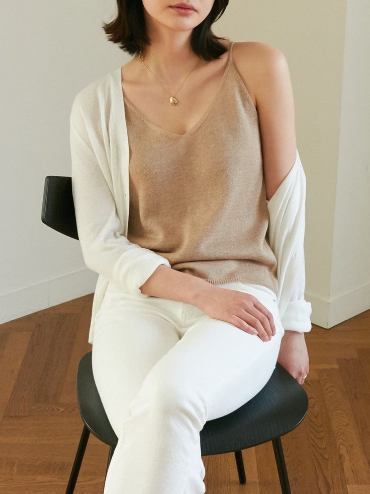 Sleeveless linen knit tank, perfectly worn in shirt with high quality stitching. Feels soft to the touch and is perfect for summer. Model is wearing MINUSEY ONE SIZE. Please allow 5-12 days shipping when in restocking.* MINUSEY ONE SIZE = EU 34-38, US 2-6* 60% Linen / 20% Rayon / 20% Acrylic* Dry clean* Made in Korea - Model Height: 171cm/5'7" (US 2, EU 34) Relaxed Fit Sweater Vest For Spring Layering, Spring Tank Sweater Vest, Spring Tank Sweater Vest For Everyday, Tank Sweater Vest For Everyday Spring Wear, Trendy Tank Sweater Vest For Summer, Trendy Summer Sweater Vest For Everyday, Neutral Knit Top For Layering, Comfortable Tops For Summer Day Out, Comfortable Summer Tops For A Day Out