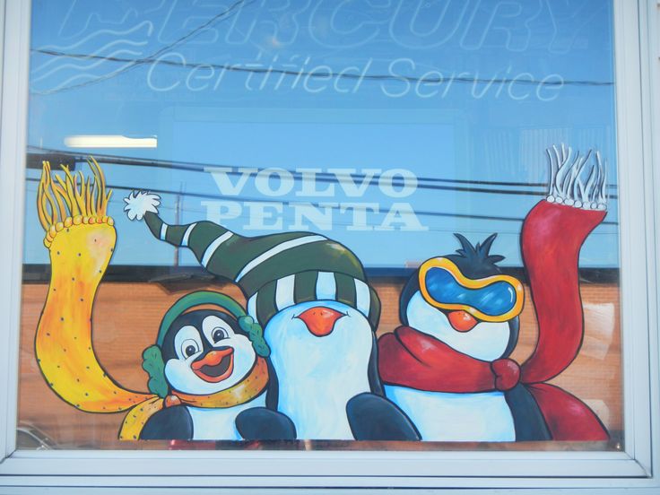 there are three penguins painted on the window