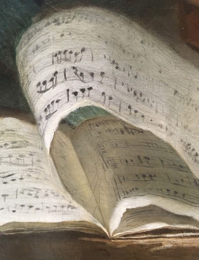 an open book with sheet music on it