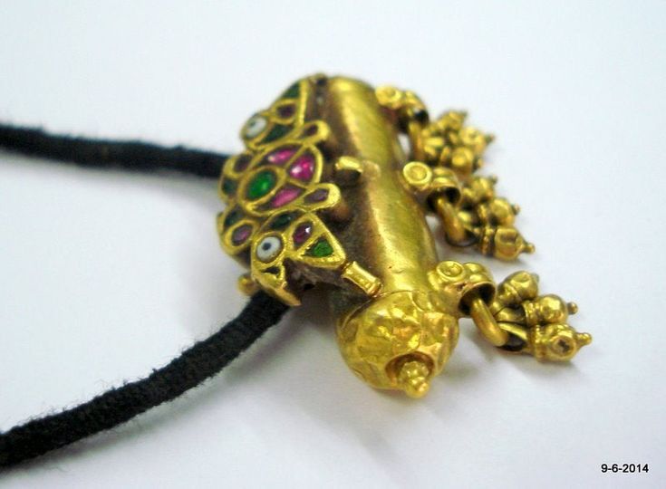 "vintage antique tribal old 22k gold amulet pendant necklace taviz from rajasthan india. nice design made of 22k yellow gold, good for jewelry collection. Note - pendant is filled with wax. Piece is much check pictures carefully for more detail. Height with bells - 3 cm(1.18\") width max.- 3.8 cm(1.5\") weight - 14.5 grams material - 22k yellow gold & original old worn piece." 22k Gold Temple Necklace Pendant For Festivals, Meenakari Pendant Temple Necklace For Puja, Meenakari Temple Necklace Pendant For Puja, 22k Gold Pendant Temple Necklace For Festivals, Traditional Yellow Gold Temple Necklace With Pendant, Temple Jewelry Necklace With Locket For Diwali, Festival Pendant Temple Necklace With Latkans, Festival Temple Necklace With Latkans Pendant, Festival Temple Pendant Necklace With Latkans