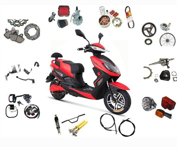 a red scooter is surrounded by various parts