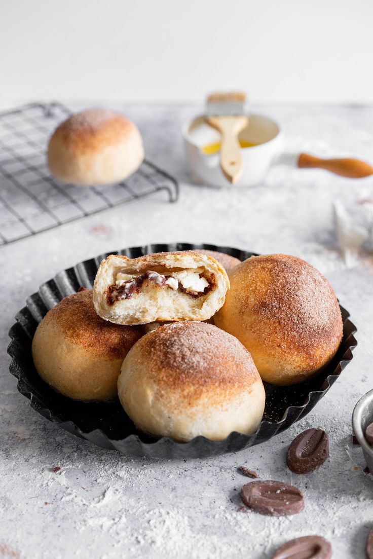 some rolls are sitting in a pan on a table