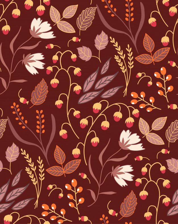 a floral pattern with leaves and berries on a brown background