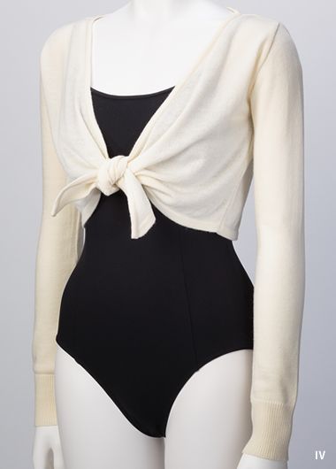 a mannequin wearing a black and white bodysuit with a bow at the back