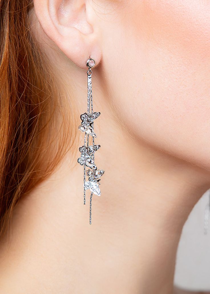 The MEADOW butterfly earrings are a fun and playful design. With 3 lightweight butterflies hanging down from a crystal post. The butterflies have hand placed Austrian crystals to add a touch of sparkle. These drop earrings are available in a bright silver or trendy gold, and measure to approximately 3 inches in length. Party Jewelry With Butterfly Dangle Charm, Silver Earrings With Butterfly Charm, Silver Butterfly Charm Earrings For Party, Garden Wedding Aesthetic, Wedding Aesthetic, Butterfly Earrings, Austrian Crystal, Luxury Accessories, Playful Design