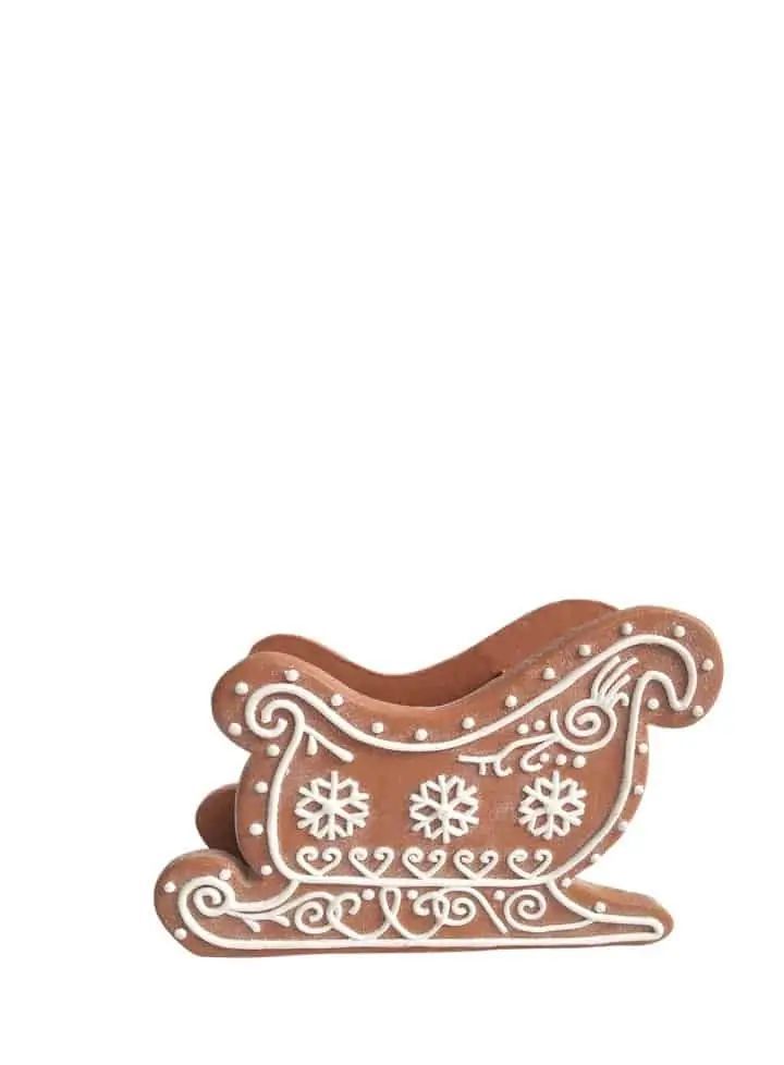 a small wooden sleigh with snowflakes on it