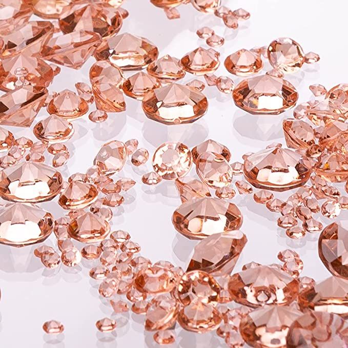 many pink diamonds on a white surface