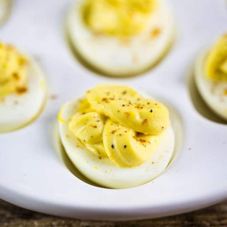 deviled eggs are arranged on a white plate