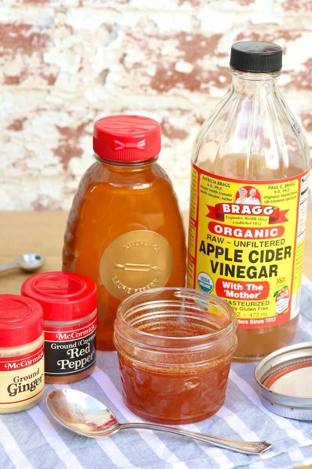 the ingredients to make an apple cider are displayed on a table with spoons