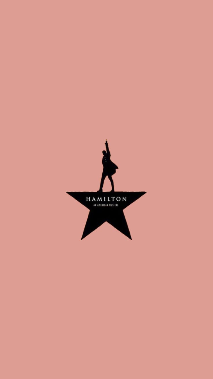 a person standing on top of a star with the word hamilton written below it in black