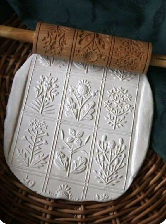 a wicker basket with a rolling pin on it