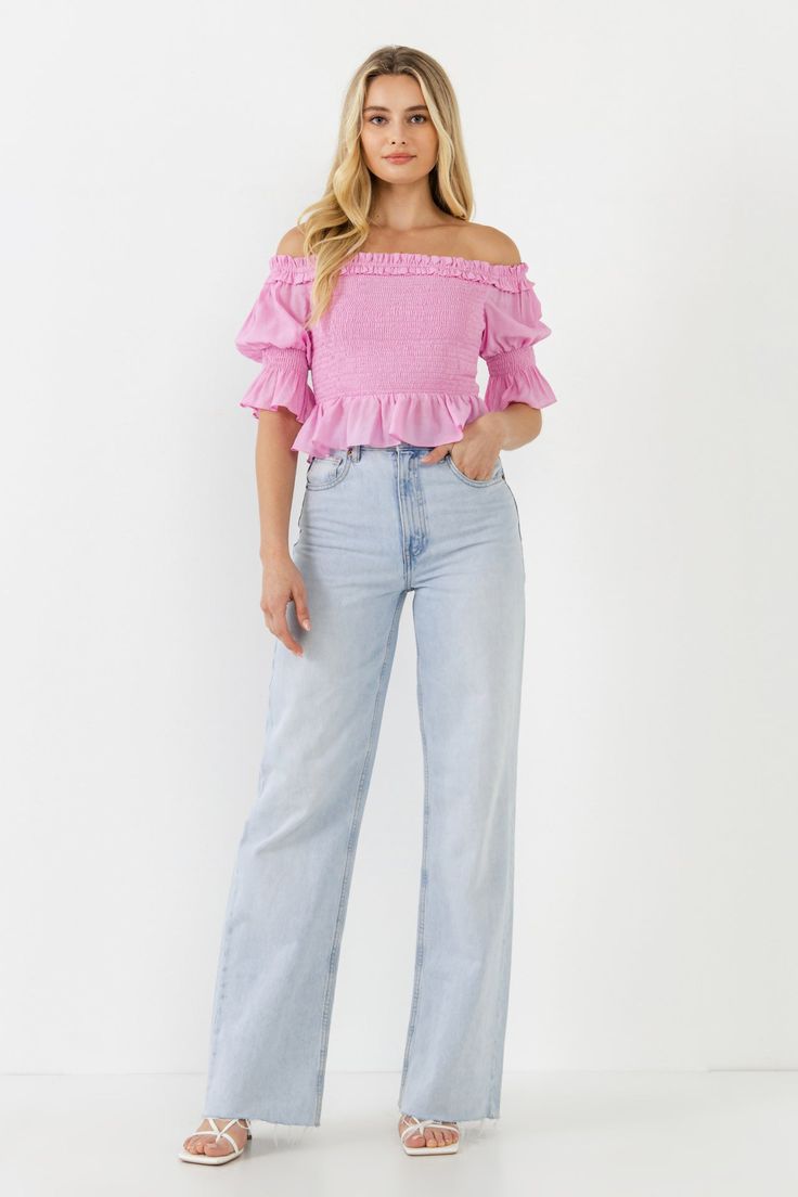 Experience the perfect blend of flirty and fun with this Off The Shoulder Smocked Crop Top. The smocked bodice and sleeve highlight the off-the-shoulder neckline for a look that's both stylish and trendy. The cropped length provides just the right amount of coverage, while the slight sheerness lends a touch of allure. The lining ensures a comfortable and confident fit. Add this top to your wardrobe and enjoy an instant favorite that can be dressed up or down. Off the shoulder Smocked bodice and Trendy Fitted Off-shoulder Smocked Top, Casual Cropped Off-shoulder Top With Ruffles, Trendy Puff Sleeve Off-shoulder Top For Spring, Trendy Off-shoulder Smocked Top For Summer, Trendy Off-shoulder Smocked Summer Top, Casual Off-shoulder Smocked Top For Spring, Trendy Ruched Off-shoulder Top For Spring, Feminine Fitted Off-shoulder Smocked Top, Feminine Summer Smocked Top With Smocked Cuffs