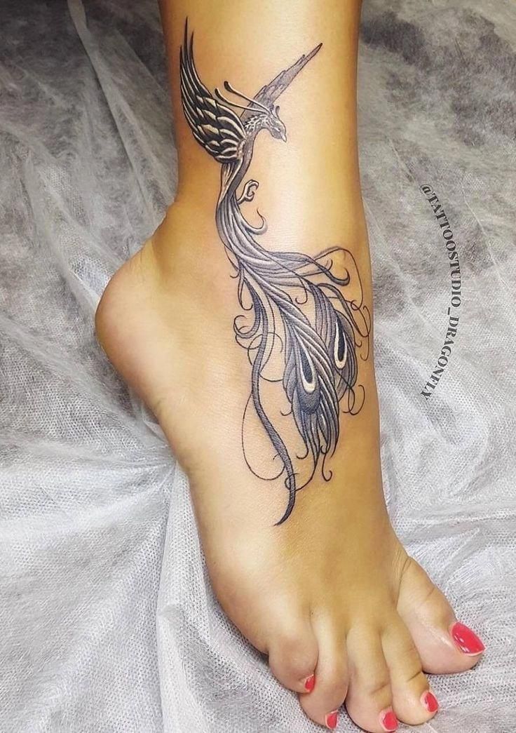 a woman's foot with a bird tattoo on her left side and the bottom part of her leg